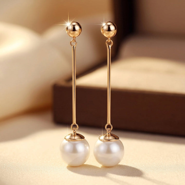 Gold Long Pearl Drop Earrings by Rose & Oliver - product image 1
