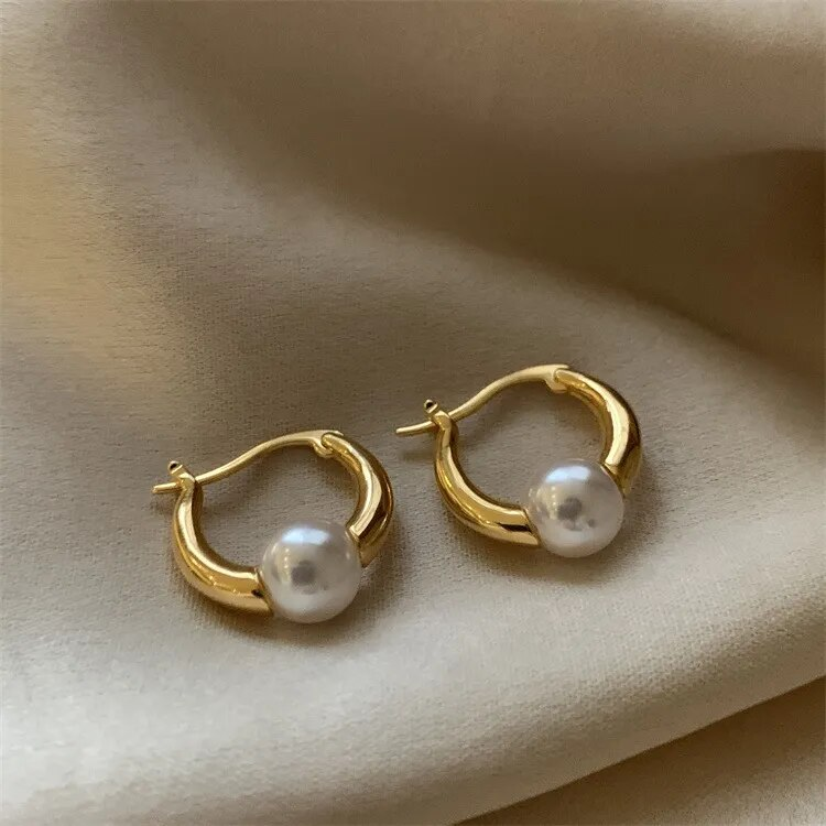 Elegant golden pearl earrings by Rose & Oliver - product image 1